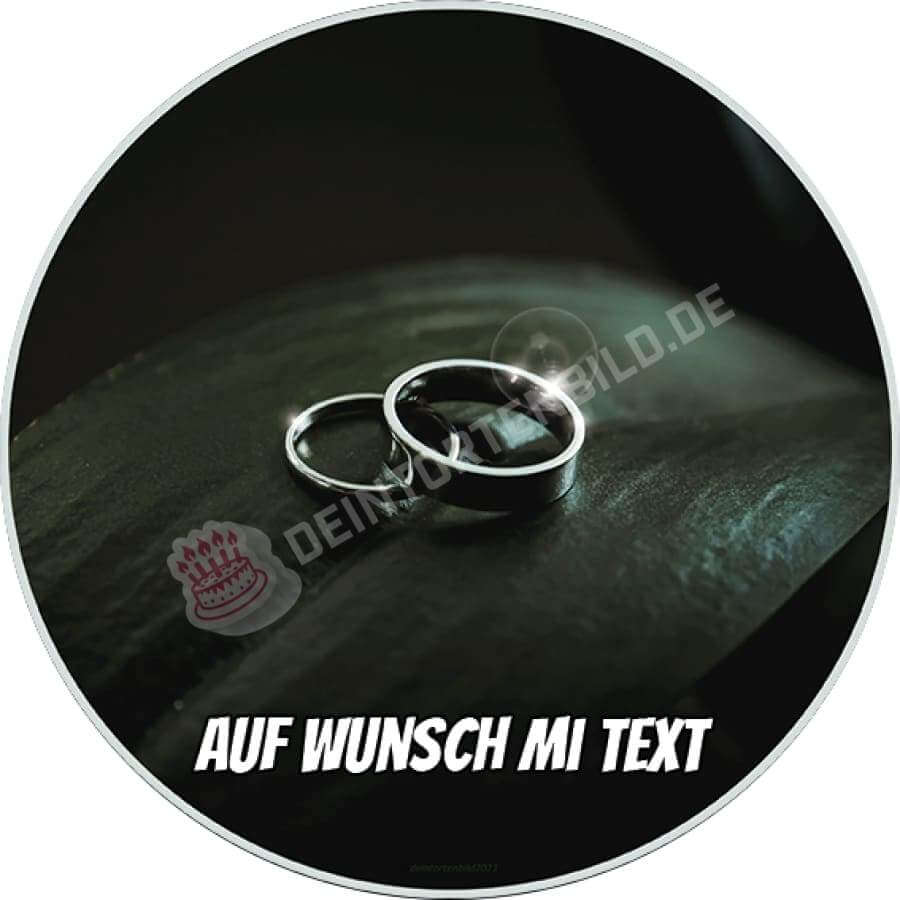 http://deintortenbild.de/cdn/shop/products/motiv-hochzeit-silberne-ringe-auf-blatt-tortenbild-657-sw.jpg?v=1637410527